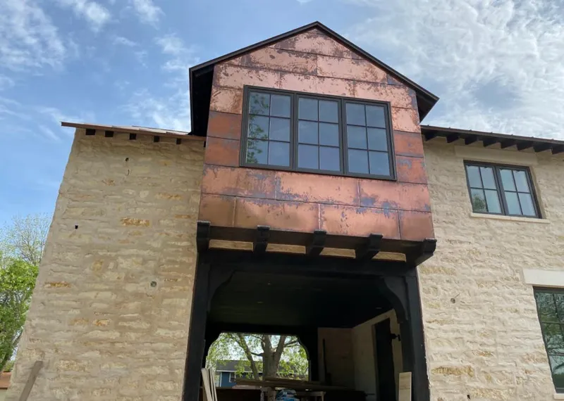 Copper metal panel facade on a stone building for Skylight Installation in Lauderdale-by-the-Sea