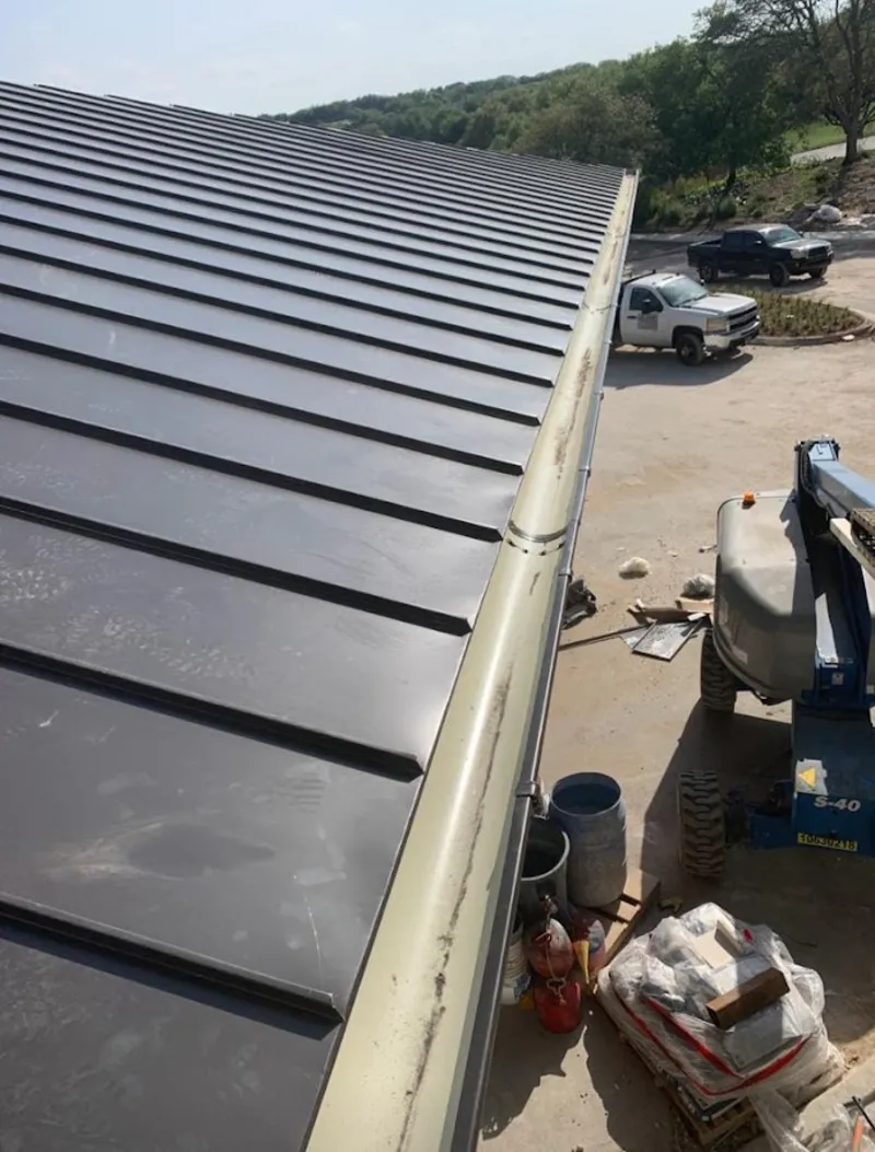 Standing seam panel and gutter detail on a metal roofing jobsite in Lauderdale-by-the-Sea